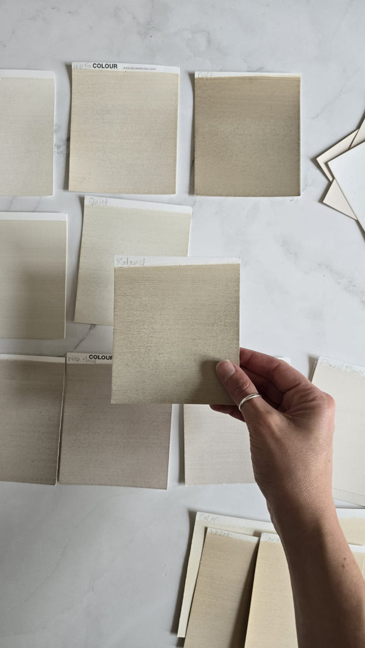 Professional compares close shades of neutrals and white limewash paint with the aid of a full range box set of colour cards | © Charlotte Cropper