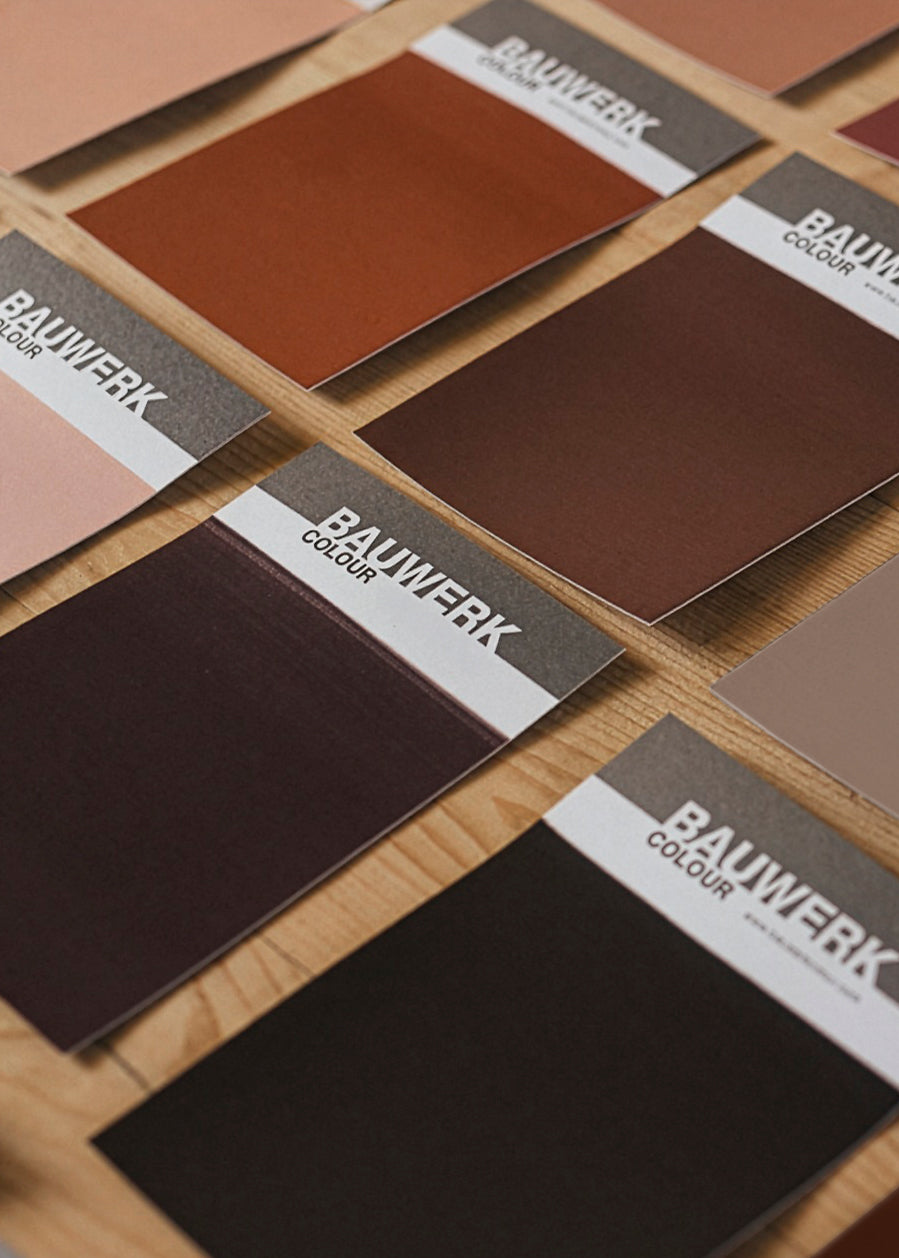 a selection of matte dark brown colour card swatches for exterior or indoor limewash and mineral paint application available in a box set | © Bauwerk Colour