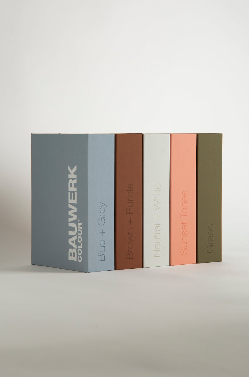 A full set of colour swatches for selecting mineral and lime wash paints assorted by colour groups in library style keepsake Box Sets | © Bauwerk Colour